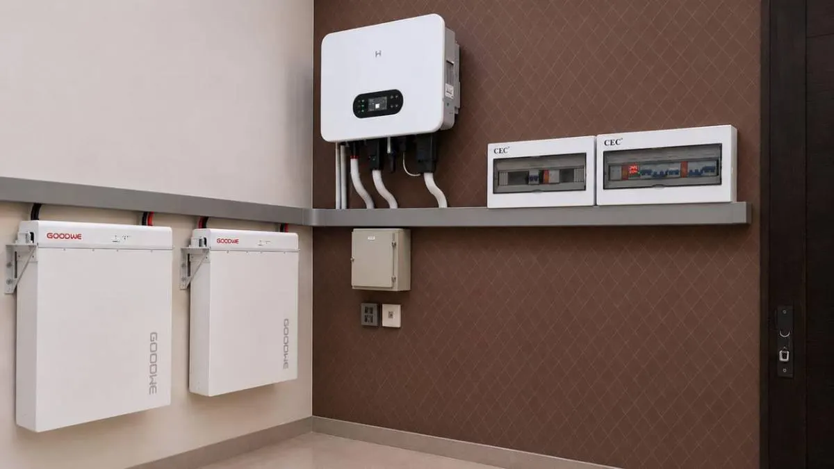 Wall mounted hybrid inverter with two lithium batteries and twin protection boards in a home