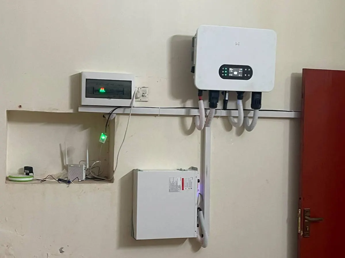 Inverter, meter and protection enclosure spread along a workshop wall