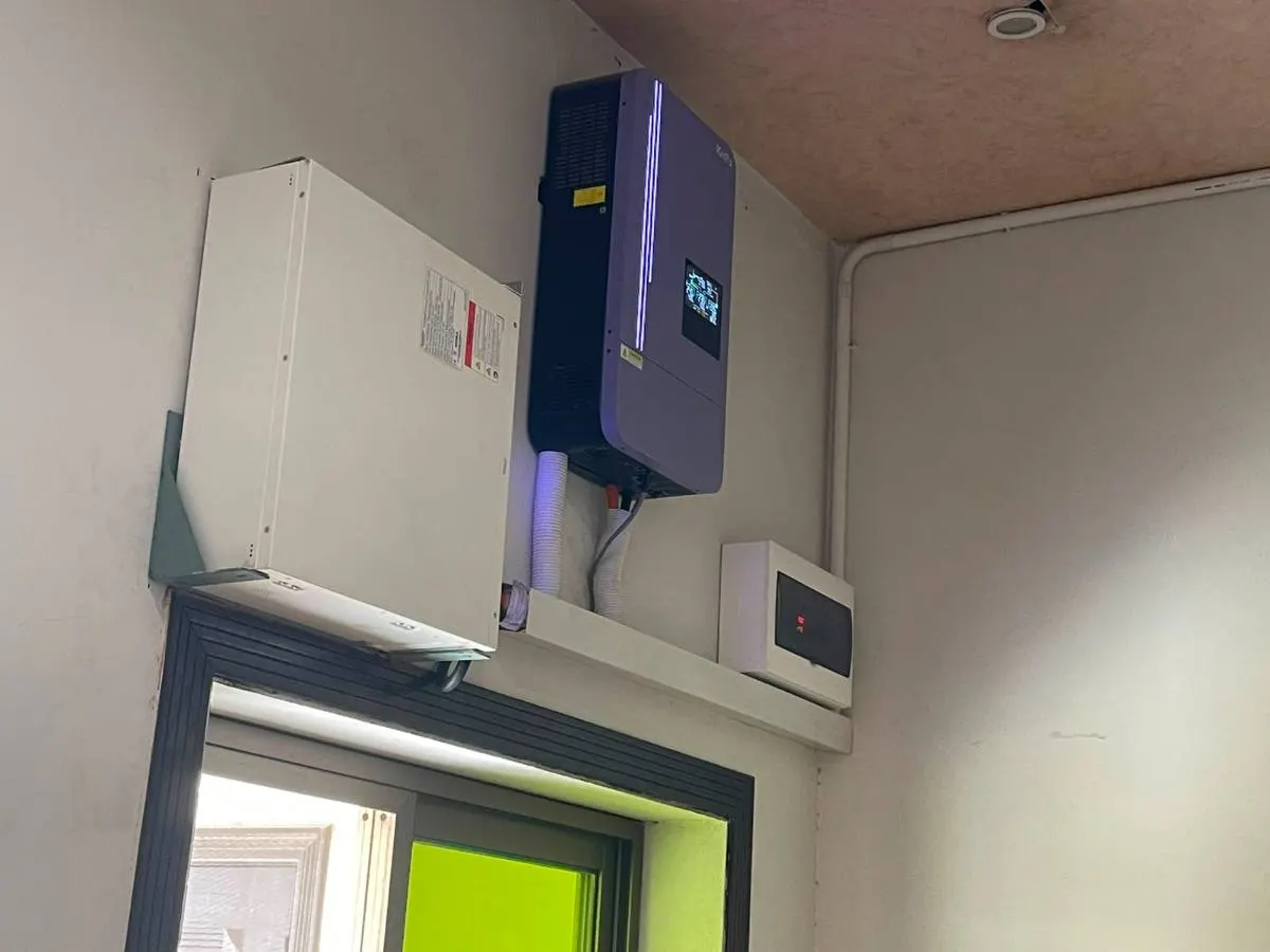 Inverter and battery mounted high above a commercial doorway