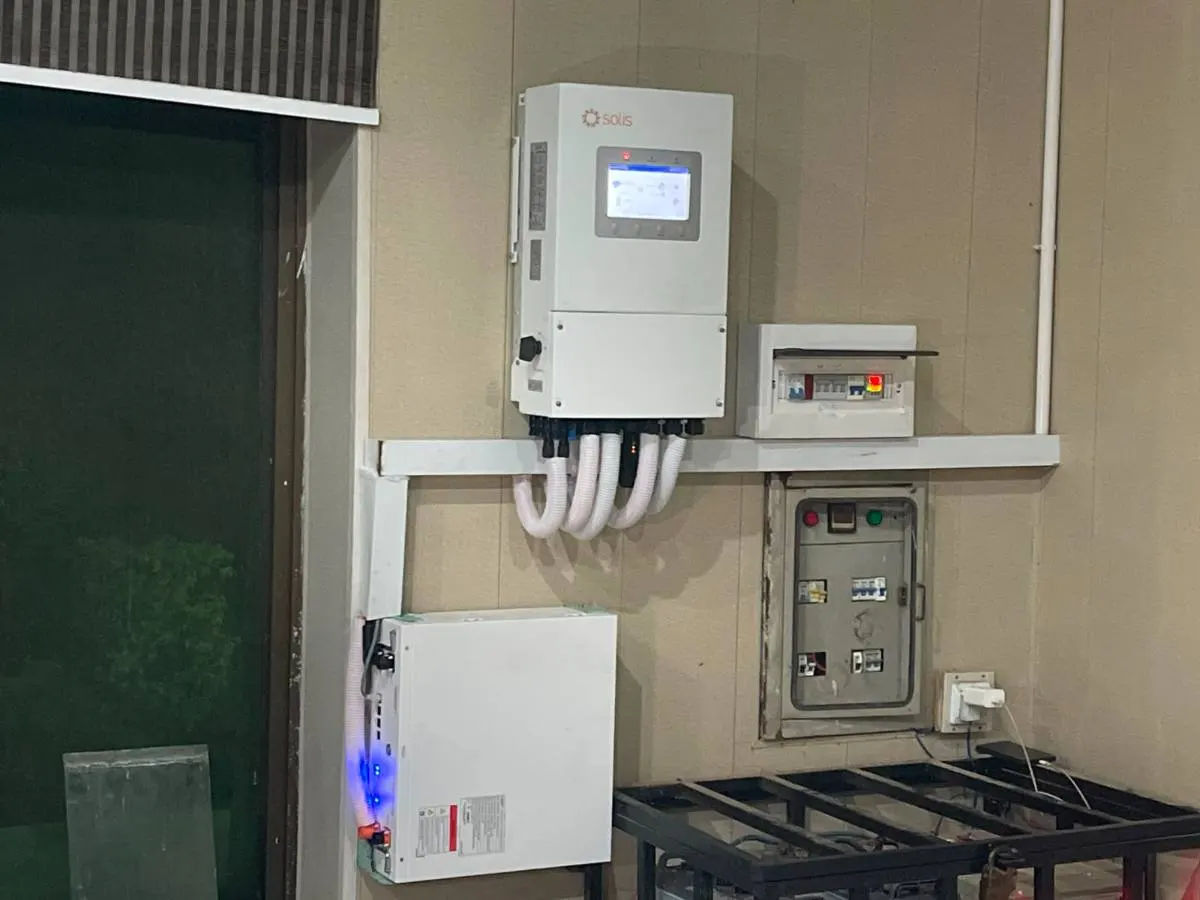 Commercial inverter with conduit to a metered panel and a battery rack